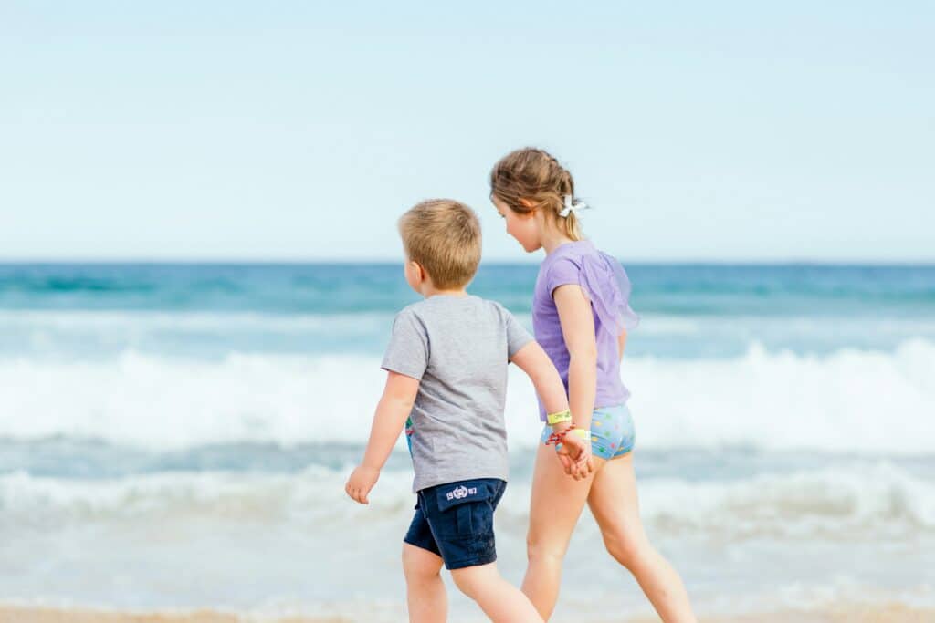 boy and girl holding hands representing a guide to parental alienation in Alberta family law