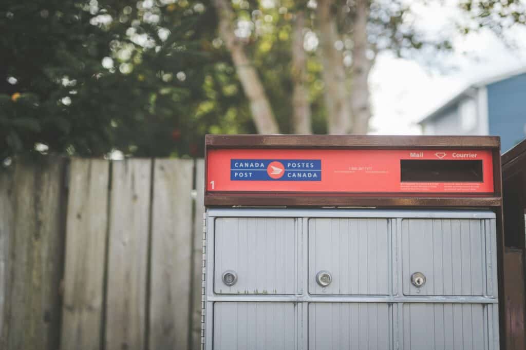 a red and blue Canada Post mailbox