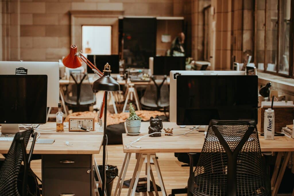 An open concept office space with computer monitors.