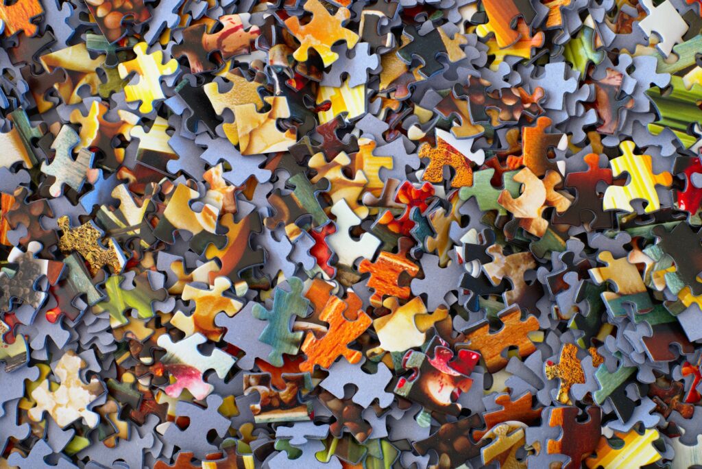 a stack of jigsaw puzzle pieces